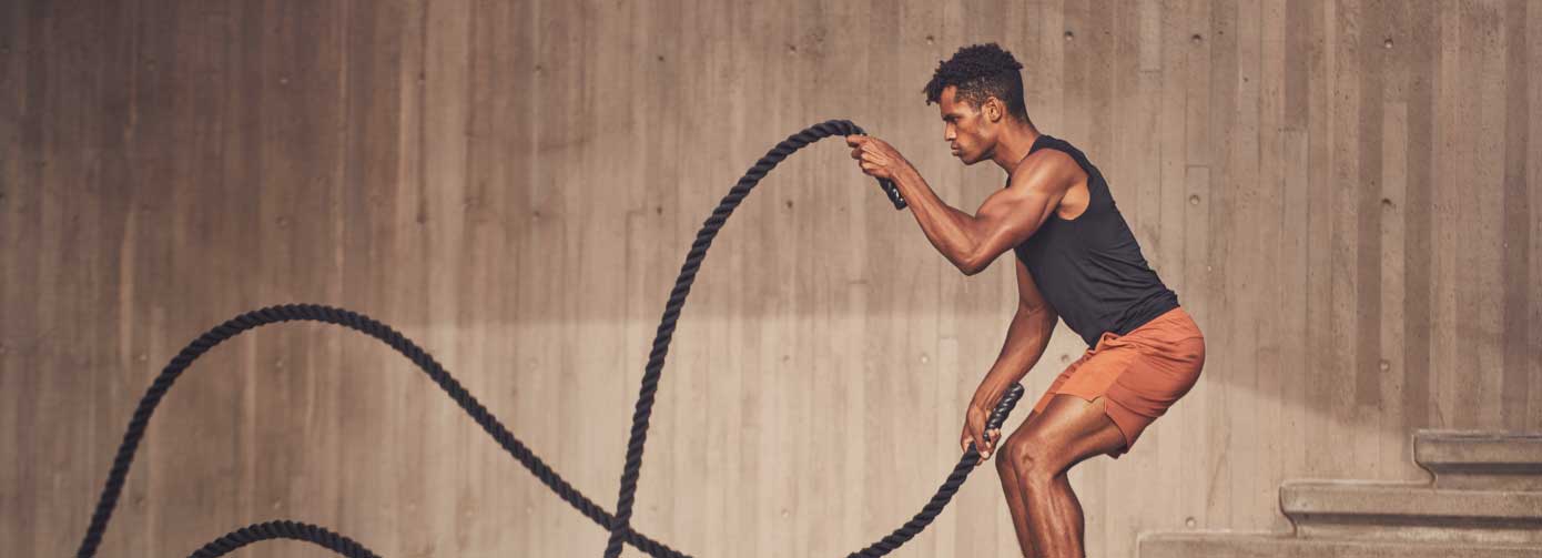 Man using battle ropes