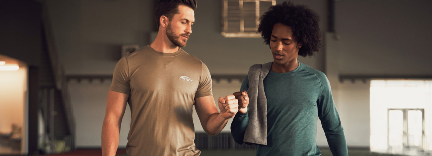 NASM Trainer giving fist bump to client