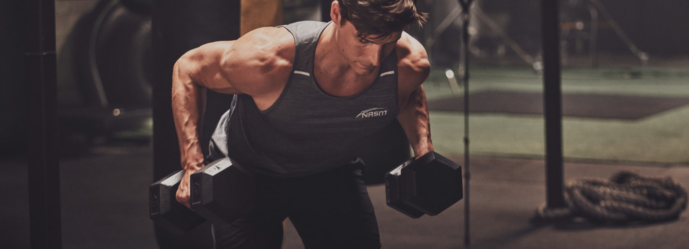 NASM trainer working out in gym