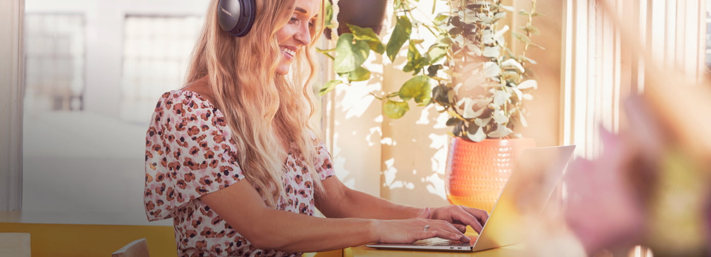 Woman smiling at laptop