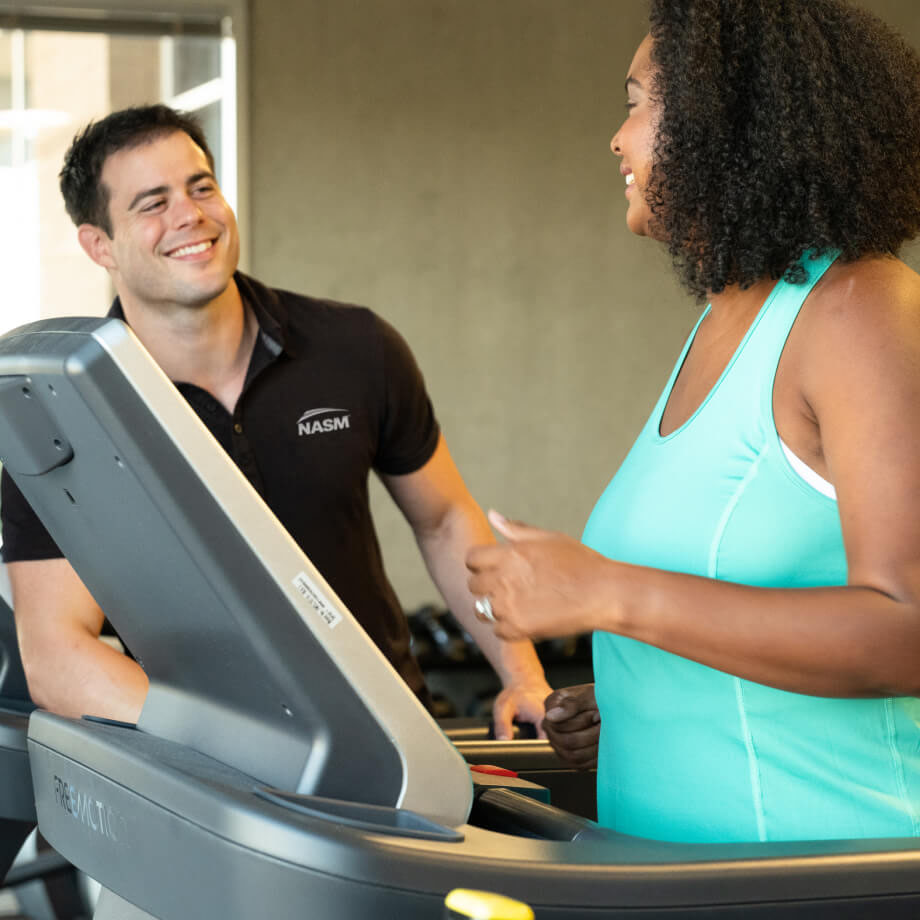 a NASM trainer working out with a woman