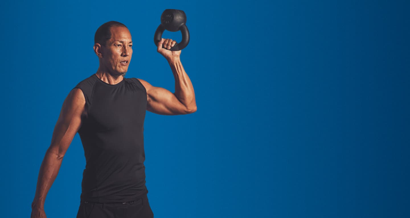 Man holding kettle bell weight