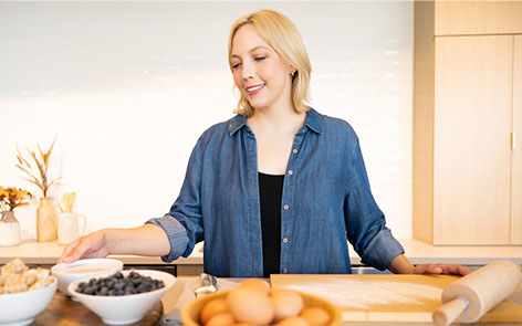 woman prepping food in kitchen